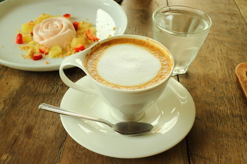 Coffee and white cake in cafe shop