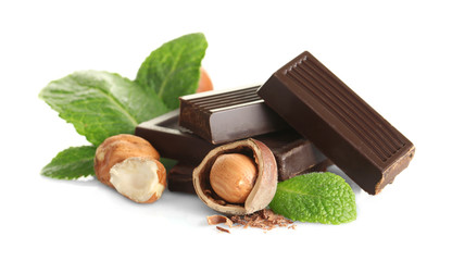 Chocolate with mint and hazelnuts on white background