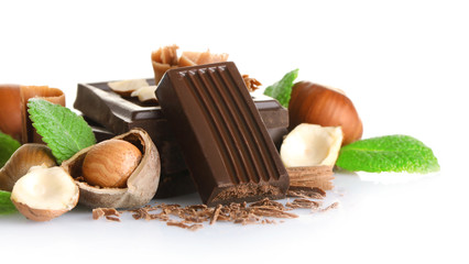 Chocolate with mint and hazelnuts on white background