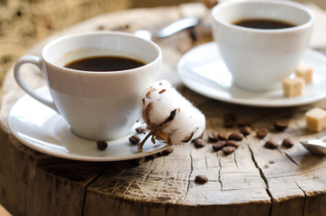 two cups coffee old wooden stump