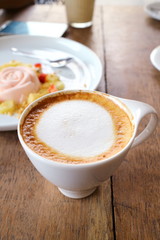 Coffee and white cake in cafe shop
