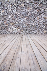 The rock walls and wooden floor.
