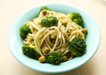 Delicious cold pasta salad in bowl on the table closeup