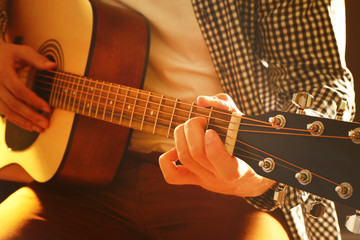 Fototapeta premium Man playing acoustic guitar