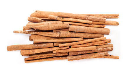 Raw Organic Cinnamon sticks (Cinnamomum verum) isolated on white background. Top view.