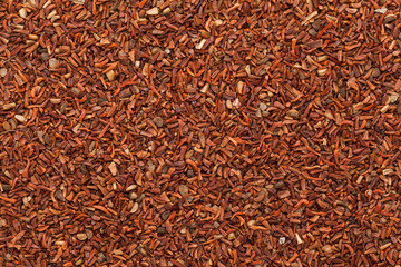 Organic Red Mahogany or Eucalyptus (eucalyptus pellita) seeds. Macro closeup background texture. Top View.