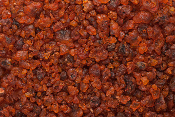 Organic Natural treated (washed) Gum Lac Resin produced by Kerria lacca insect. Macro close up background texture. Top view.