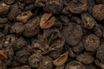 Organic dried Indian gooseberry (Phyllanthus emblica) with whole seeds. Macro close up background texture. Top view.