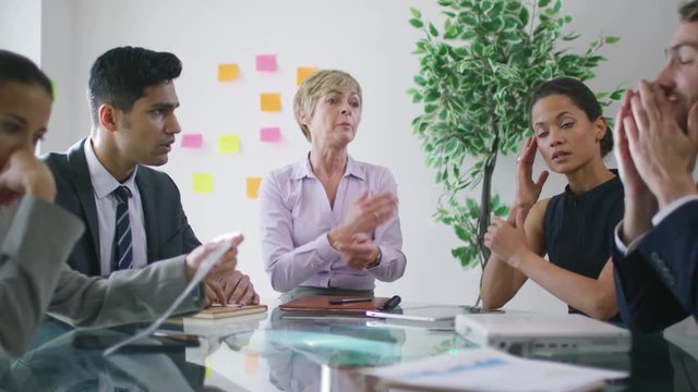  Stress in the workplace - corporate business team argue over poor performance