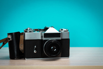 Vintage camera on wooden background