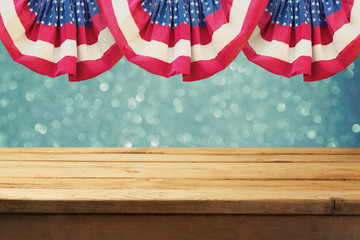 Independence day of America patriotic background with empty wooden table over USA flag. Memorial...