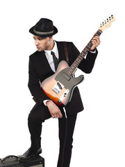 businessman with guitar looking away.