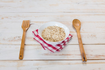 Bowl of porridge on wooden table