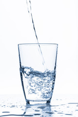 water splashing from glass isolated on white background