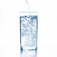 water splashing from glass isolated on white background