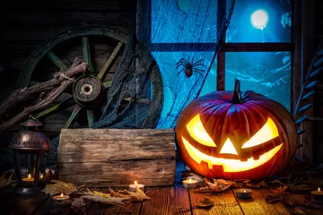 Rolgordijnen Halloween pumpkin head jack lantern with burning candles © Alexander Raths