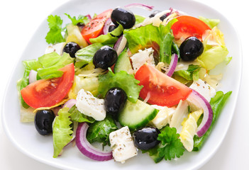 Greek salad isolated on white