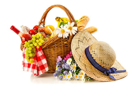 picnic basket with fruit bread and wine