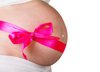 Pregnant woman with red bow on her stomach in anticipation  girl isolated  white background.