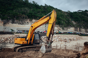 Fototapeta na wymiar Excavators machine in construction site on sky background