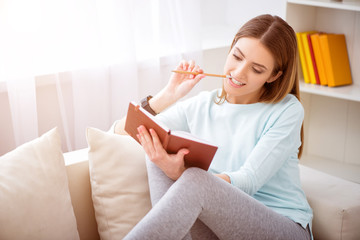 Charming woman resting on the couch 