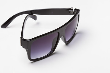 Black classic sunglasses on a white background