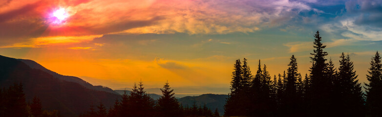 Fototapeta na wymiar God rays on sunset mountains silhouette - A play of colors at sunset in the mountains - Fagaras mountains, Sibiu county, Romania, Barcaciu cottage area, 1550m, 6frame.