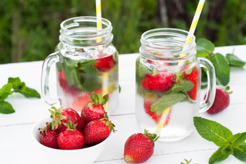 Fototapeta na wymiar Cold drink with mint and strawberry
