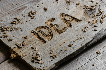 Idea word carved into the old board or wood