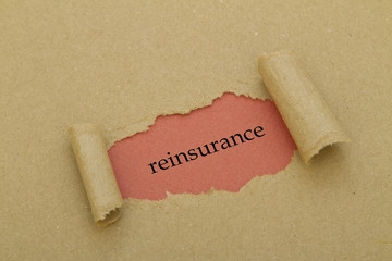 Reinsurance word written under torn paper.