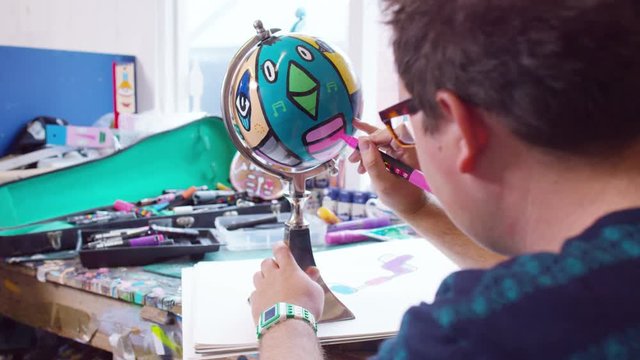  Modern graphic artist at work in his studio