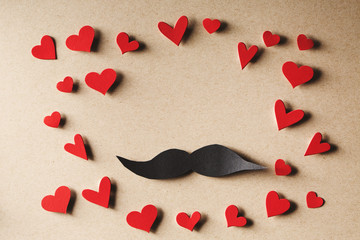 Paper mustache with small red hearts