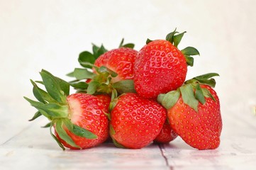 Strawberries on the wooden background