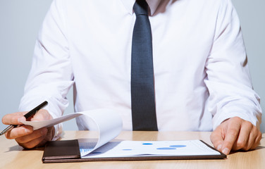 Businessman examining documents