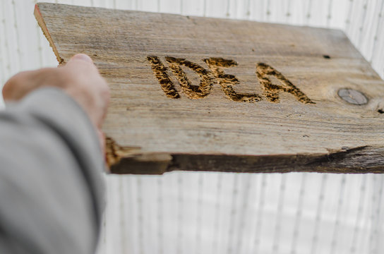Idea word carved into the old board or wood