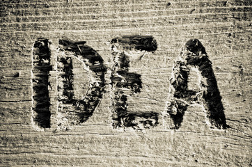 Idea word carved into the old board or wood