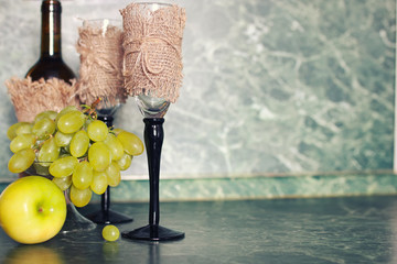 holiday set wine bottle with green grape on background