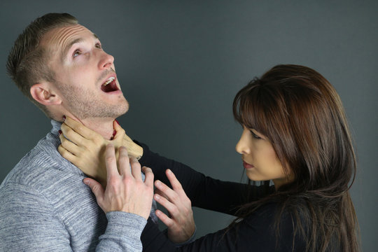 young woman strangling her boyfriend 