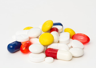 A variety of painkilling pills,tablets and drugs piled up on an isolated white background.