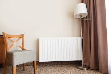 Heating radiator in a cozy interior.