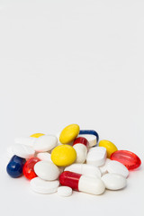 A variety of painkilling pills,tablets and drugs piled up on an isolated white background.