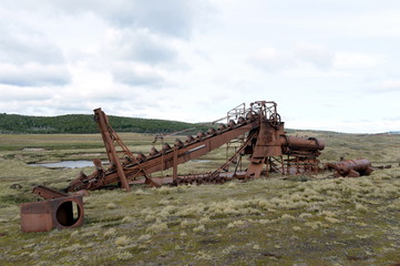 Abandoned gold mine at lake Lago Blanco. English mechanical dredge was engaged in gold mining from...