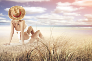 Fototapeta na wymiar woman in bikini and sand 