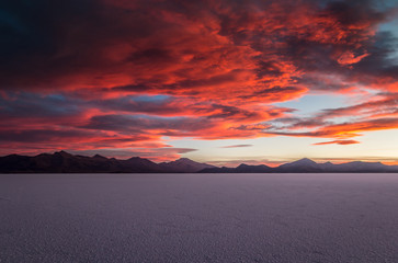 Fototapeta na wymiar Red sunset in salt lake - Uyuni, Bolivia