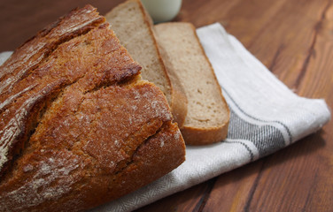 Home-made bread on wooden background