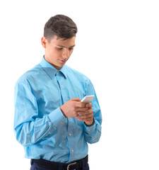 Trendy teenager boy texting on white smartphone isolated on whit