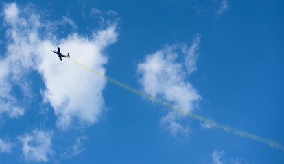 plane with colorful trail in the sky at Kharkiv airshow