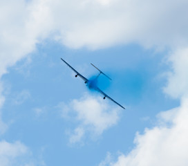 plane with colorful trail in the sky at Kharkiv airshow