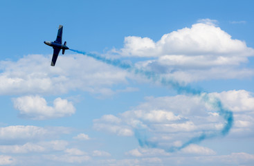 plane with colorful trail in the sky at Kharkiv airshow