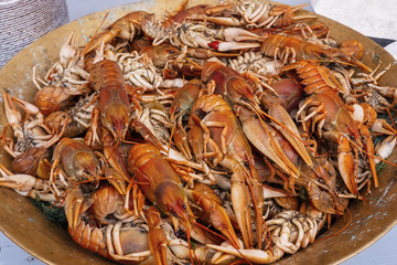 Copper plate with boiled red crawfishes